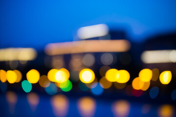 Poster - Blurred abstract urban background with street lights in bokeh shape