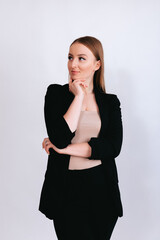 Business woman l in a black classic suit isolated on a white background.