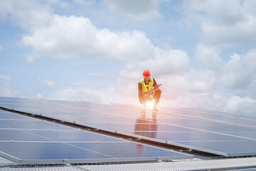 Poster - Engineers checking solar panel on the roof of factory.