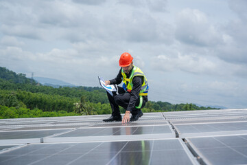 Poster - Engineers checking solar panel on the roof of factory.