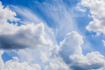 White fluffy clouds against a blue sky.
