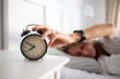 © Melinda Nagy - alarm clock and woman sleeping in bed sleep quality