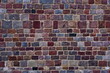 Old  wall of colorful natural stones square brick