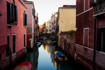 Canvas Print - The old bridge made with wooden on the typical canal in Venice