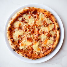 Top View Of Fresh Hawaiian Pizza With Sauce On Marble Background 
