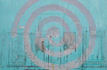 Grey Spiral Against A Light Blue Color. Wall Texture Close Up