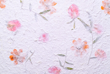 Mulberry paper sheet decorated with dry flower and leaf texture background