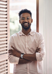 Poster - Happy, carefree and positive young business man standing arms crossed in his office at work. Portrait of a smiling male employee wearing glasses, looking positive and working at his job in the day
