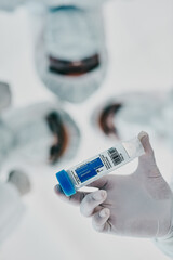 Poster - Covid, scientists and vaccine vial while a group medical practitioners, chemists and researchers stand together from below. Innovation cure, treatment and medicine for virus and clinical trial