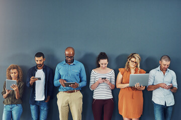 Aufkleber - A group of people distracted due to the overuse of technology against gray studio background. Many employees are addicted and obsessed with social media with a dependence on gadgets or devices