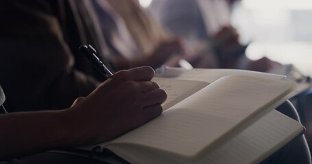 Poster - Audience taking notes at a conference, convention or business trade show sitting in a row, attending a presentation. Corporate men and women attending a company meeting, training event or seminar