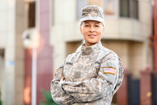 Mature Female Soldier In Military Uniform Outdoors