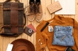 © Pixel-Shot - Male accessories for travelling with compass on wooden background