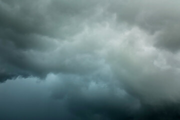 Wall Mural - black cloud and thunderstorm before rainy, dramatic black clouds and dark sky