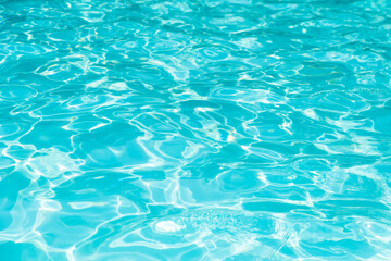 blue and bright water in swimming pool with sun reflection, motion of ripple water and gentle wave i