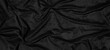 Beautiful smooth elegant wavy black satin silk luxury cloth fabric texture, abstract background design pattern, top view