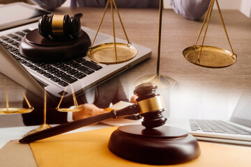 Male lawyer working with contract papers and wooden gavel on tabel in courtroom. justice and law ,attorney, court judge, concept.