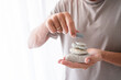 © Westend61 - Man stacking stones on hand at home
