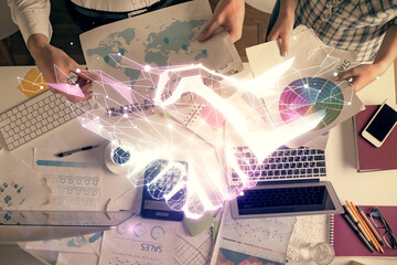 Poster - Double exposure of man and woman working together and the handshake hologram drawing. Computer background. Top View.
