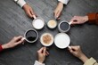 © New Africa - People holding different cups with aromatic hot coffee at grey table, top view