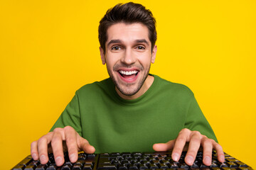 Aufkleber - Photo of shocked funny guy dressed green pullover typing modern device isolated yellow color background