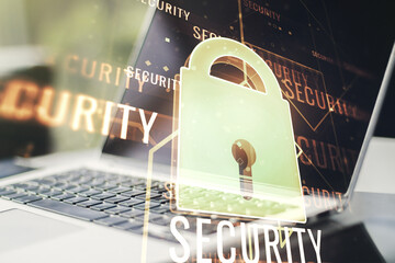 Poster - Double exposure of creative lock hologram with chip on laptop background. Information security concept