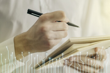 Poster - Double exposure of circuit hologram and man hand writing in notebook on background. Research and development hardware concept