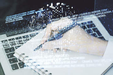 Poster - Creative code skull hologram and hand writing in diary on background with laptop, cybercrime and hacking concept. Multiexposure