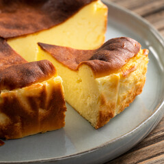 Wall Mural - Delicious sliced baked Basque Burnt Cheesecake in a plat served for eating.