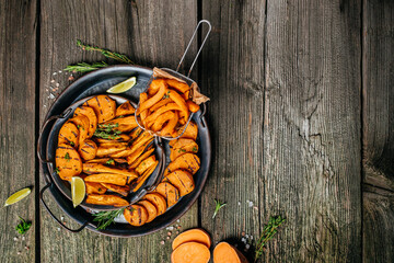 Wall Mural - Sweet potatoes fries with lime and herbs yogurt sauce. banner, menu, recipe place for text, top view