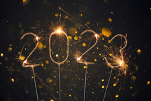 2023 Happy New Year Silvester Greeting Card With Burning Golden Sparklers Shiny Glitter Lights Bokeh