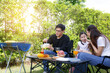© atitaph - Asian family happy bright cute daughter Barbecuing in the courty