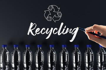 Canvas Print - Plastic bottles with the recycling icon and painted recycling arrows and the word recycling. Concept of nature and environment protection. Plastic recycling.