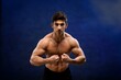 © BillionPhotos.com - Brutal sweaty strong young man athlete with naked body standing showing strong pumped up biceps. Sport men body concept.