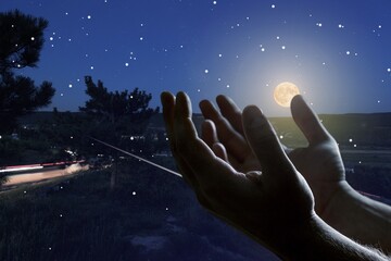 Canvas Print - Hands of muslim man praying on sky background