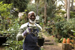 © Wavebreak Media - Portrait of happy senior african american man in garden