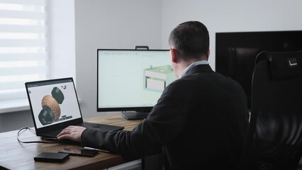 A senior engineer works for an industrial corporation designing parts for automobiles.