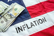 Leinwandbild Motiv USA flag, the inscription inflation on it and money.
