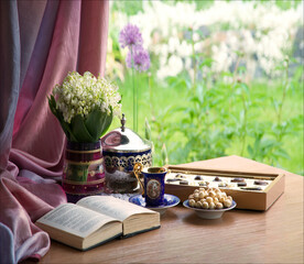 Wall Mural - Still life with a bouquet and an old book