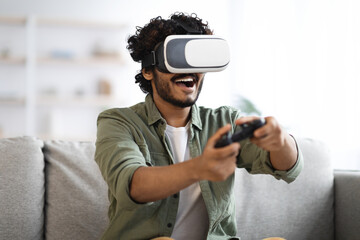 Young man trying virtual reality, playing video games