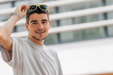 Wall Mural - portrait of young man in summer with sunglasses