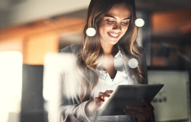 Aufkleber - Working late, overtime and dedication with a happy, positive and motivated business woman working on a tablet in her office. Young female executive smiling while feeling dedicated and determined