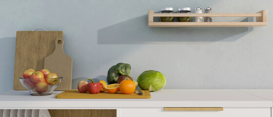 Modern white kitchen countertop with fruits and vegetables on wooden chopping board and copy space