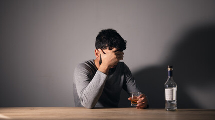 Poster - Man holding glass of alcohol