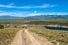 A Dirt Road Leads To The Oakley Dam And Lower Goose Creek Reservoir In Oakley, Idaho, USA