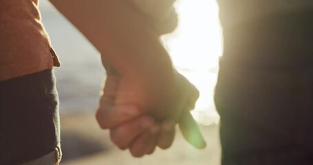 Canvas Print - Romantic, in love couple holding hands on the beach showing love, affection and care enjoying a beautiful sunset sea view. Romance closeup of a boyfriend and girlfriend bonding together by the ocean