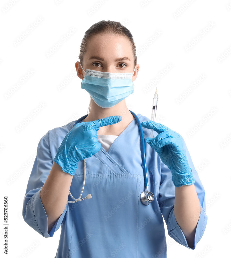 Doctor with syringe on white background