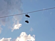 Shoes Hanging From Telephone Wire