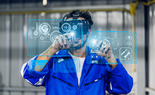 Professional Engineer Technician Worker Industrial Man Wearing Blue Safety Uniform Working Control Using Glasses Of Technology Virtual Reality Headset In Factory.business And VR Technology Industry