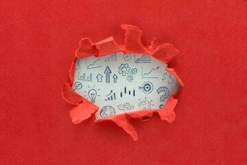 Wall Mural - Hole in the red paper with torn sides and hand drawn business strategy